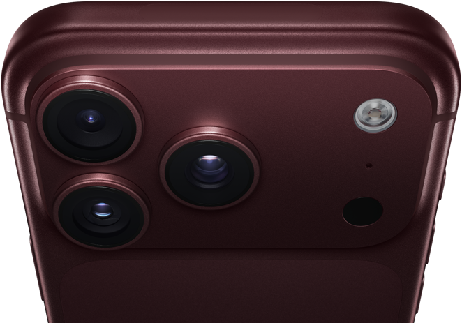 iPhone 18 Pro Max, burgundy colour (dark red), back exterior, Pro Fusion camera system at top, 3 lenses, variable aperture blades partially closed, flash, microphone and LiDAR Scanner, top exterior, mobile antenna, flat sides, rounded edges